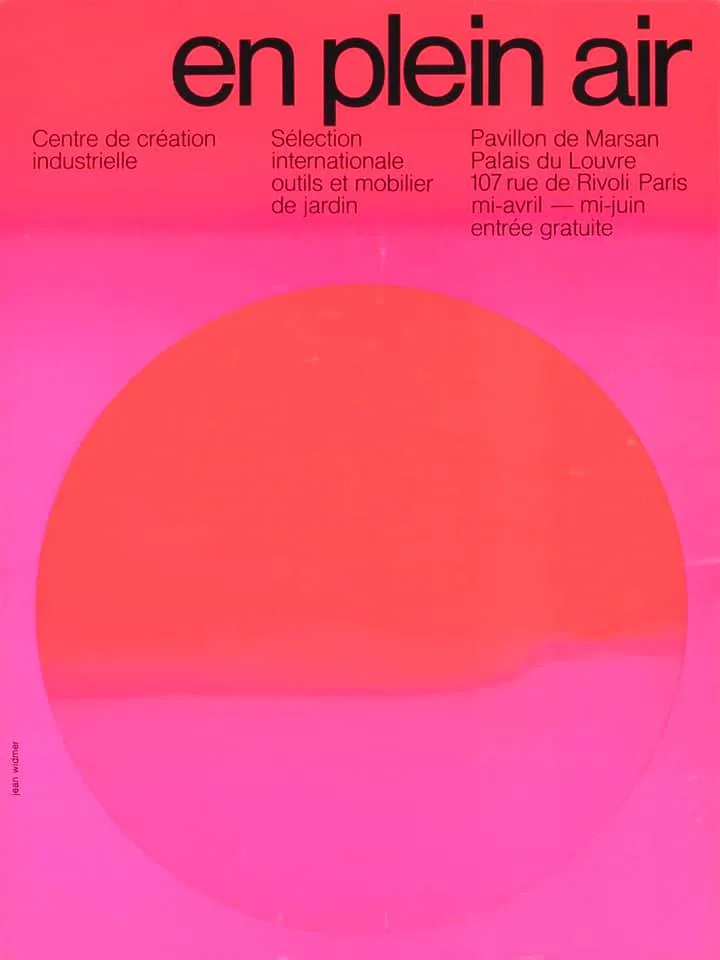 Pink poster with a large red-orange circle like a sun, and the title en plein air in black at the top.